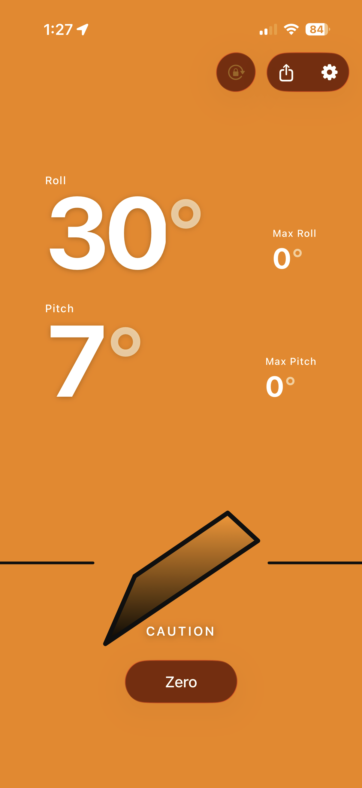 Caution state &mdash; the screen glowing amber as the angle climbs